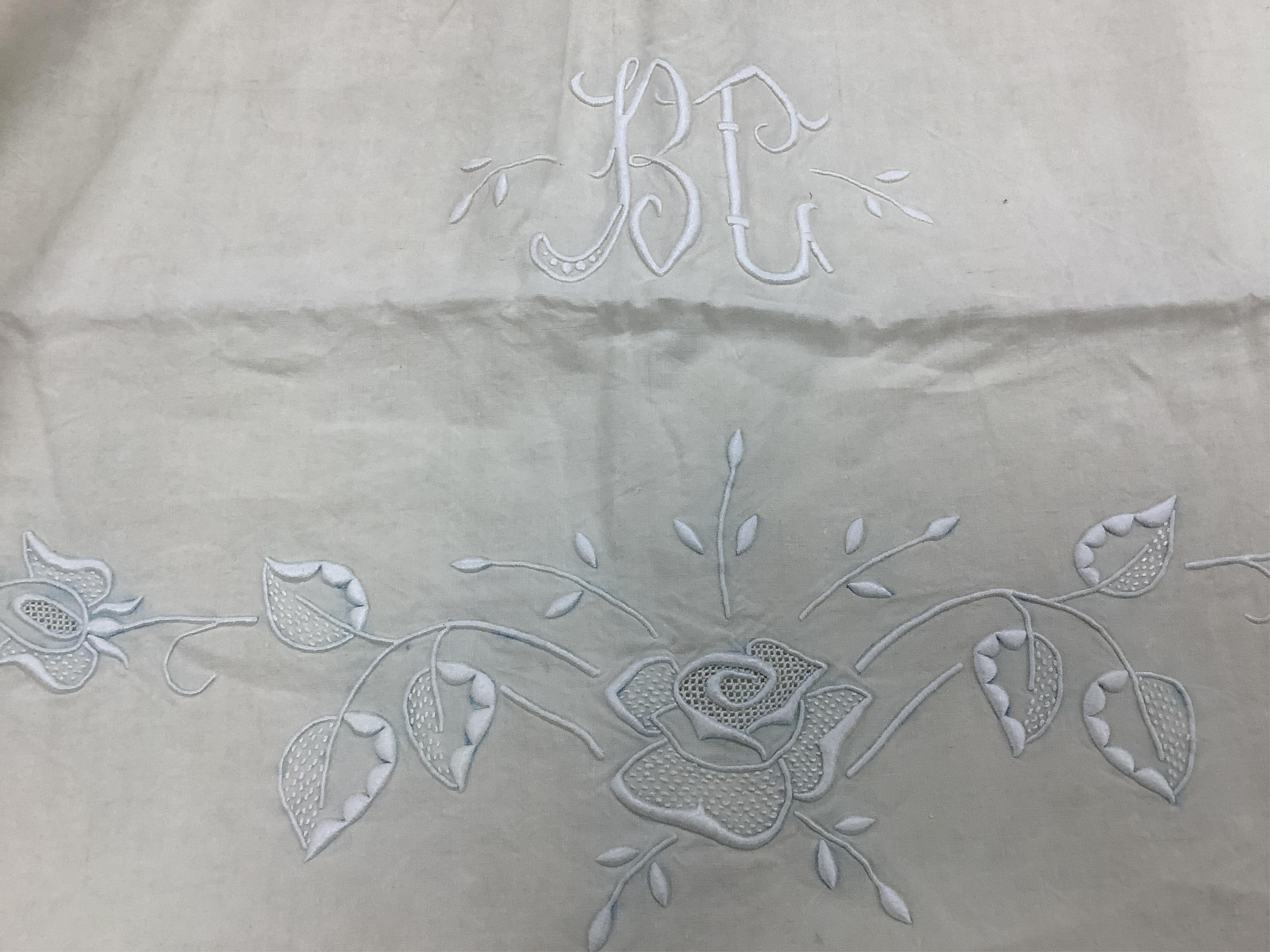 Four French provincial linen floral embroidered and drawn thread turn back, wide and long top sheets. Each sheet with different embroidery, dimensions and shades of linen, being ecru to off white. Condition - ecru sheet,